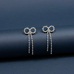 Bow charm silver earrings